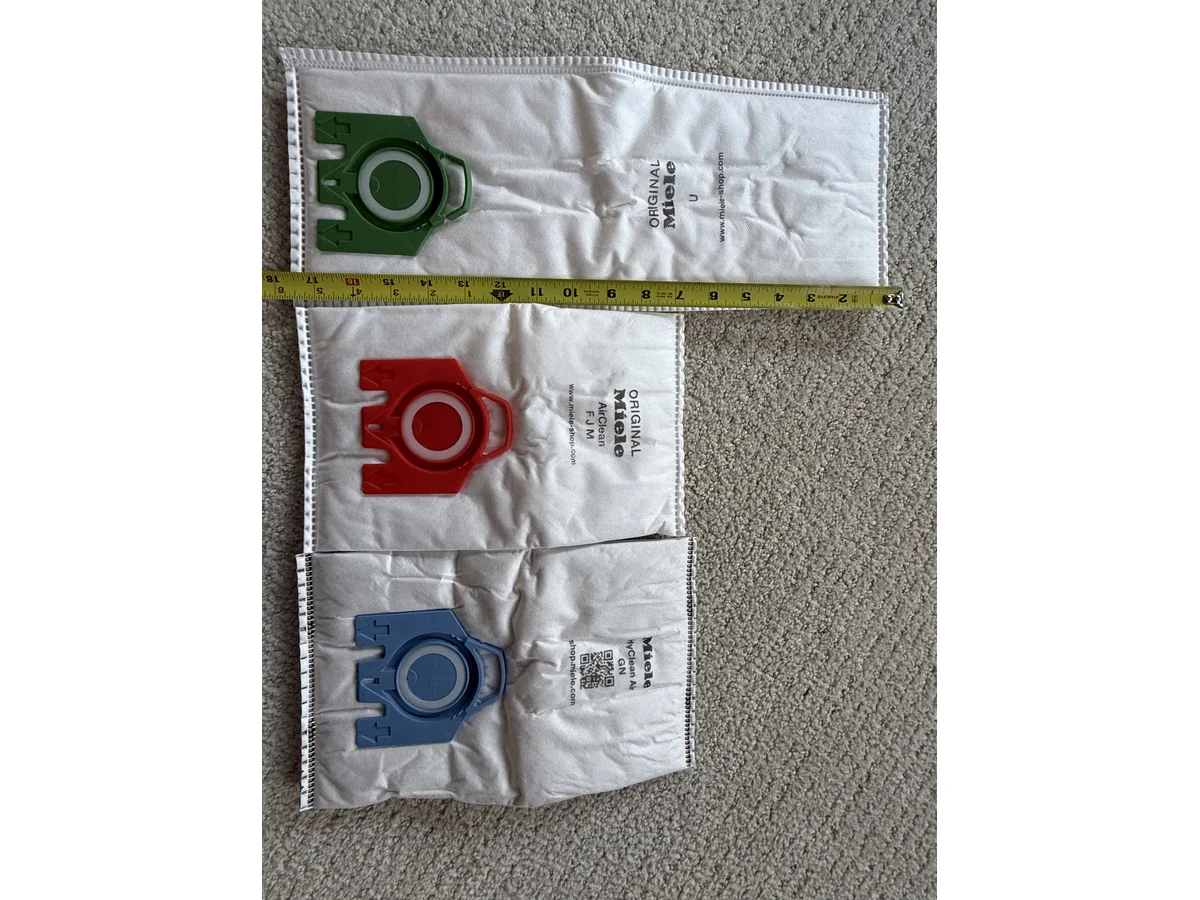 Miele GN FJM and Type U vacuum bags measured side by side by width